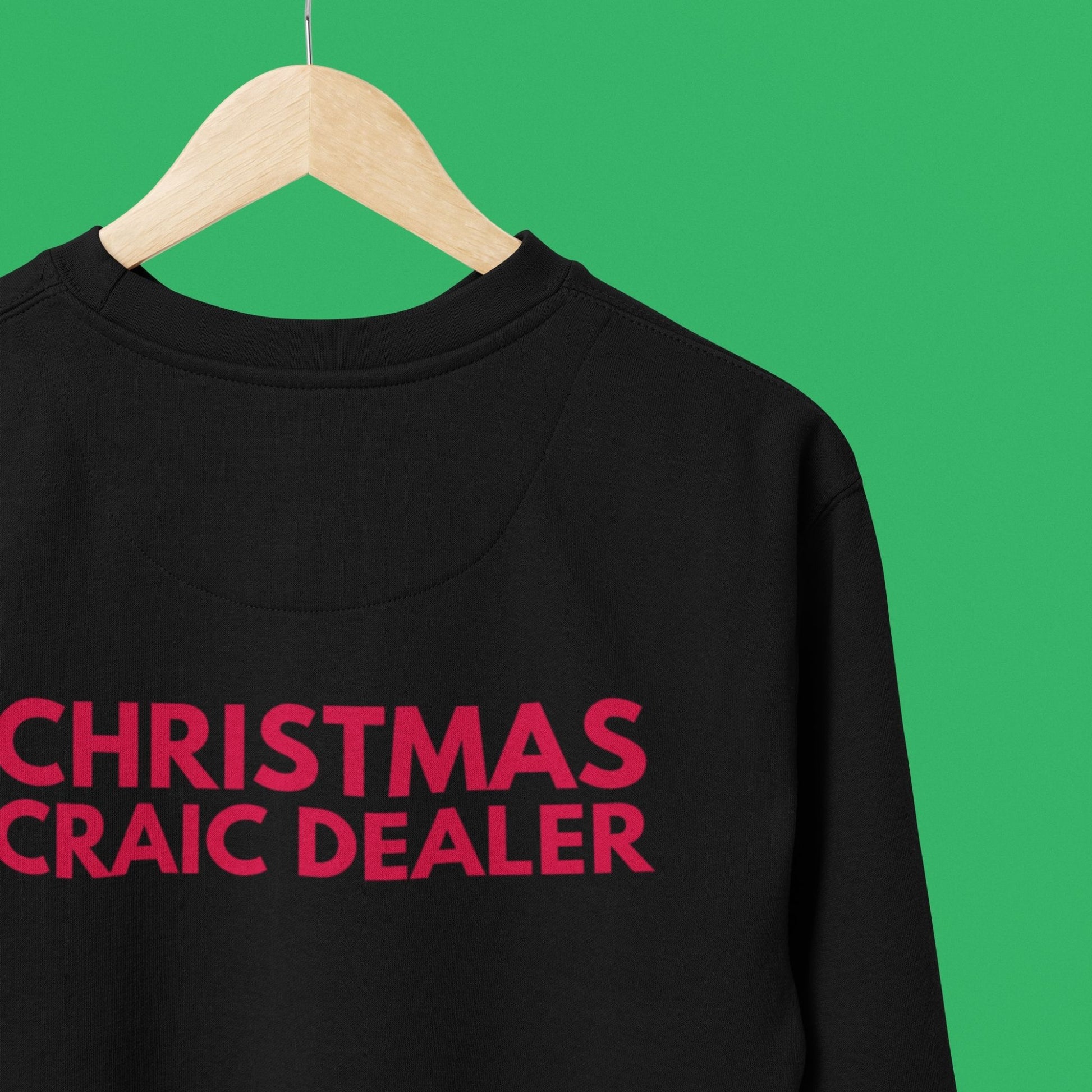 Black sweatshirt with red text 'CHRISTMAS CRAIC DEALER' on a green background