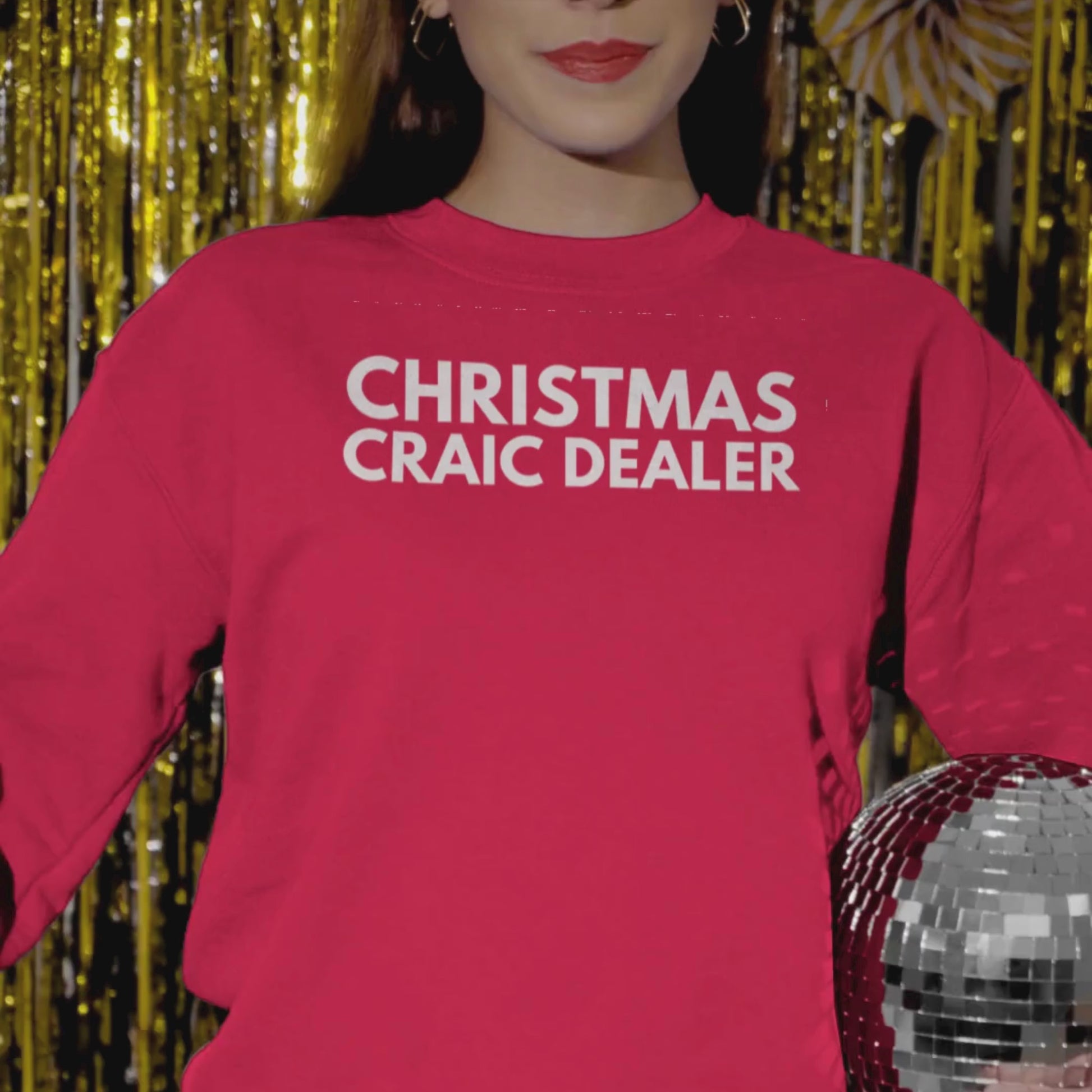Red sweatshirt with Irish humour 'Christmas Craic Dealer' text on a woman celebrating Christmas and New Year.