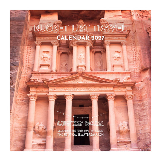 Bucket List Travel Calendar 2027 cover featuring Petra in Jordan, a colourful 12-month world travel wall calendar and gift for travel lovers and adventurers.