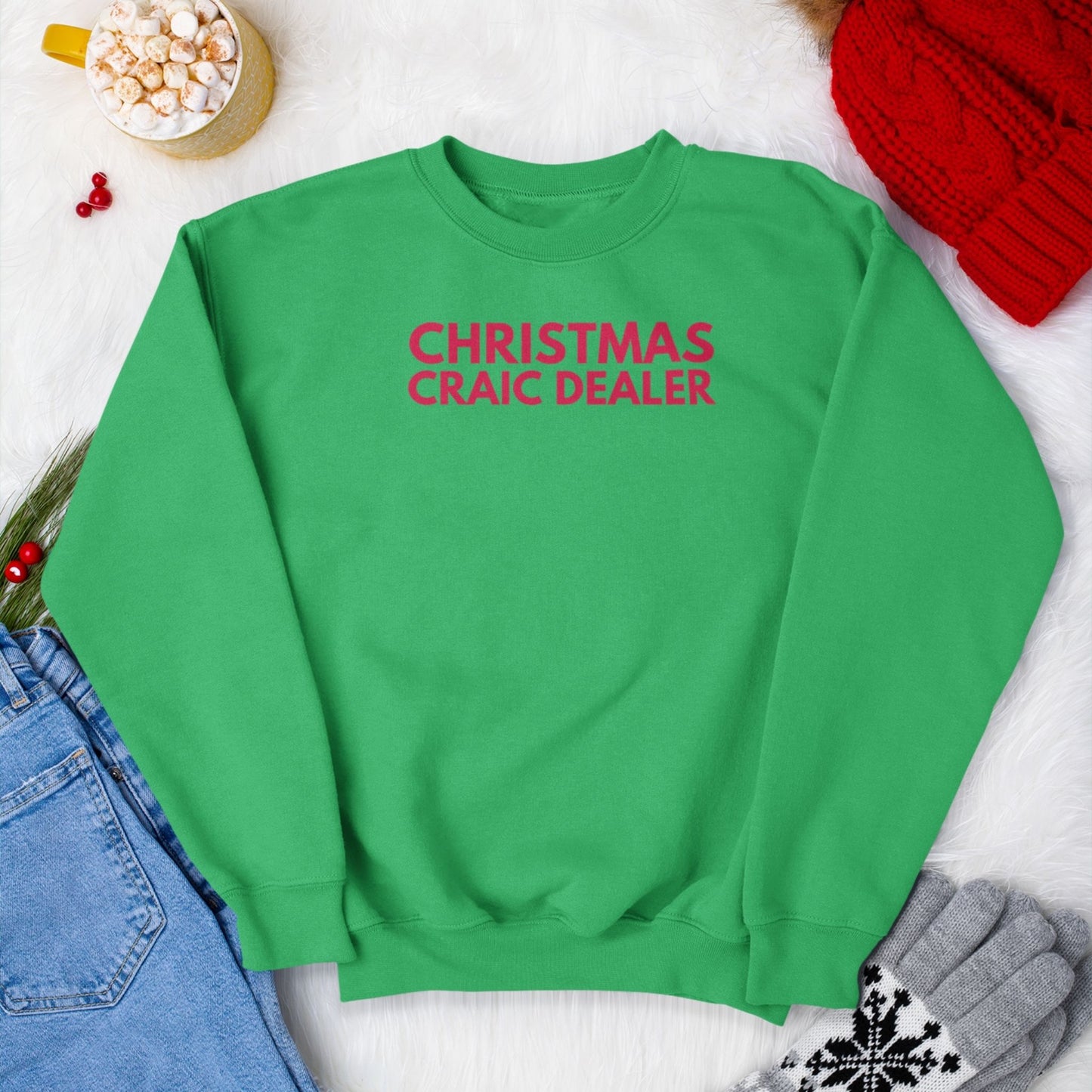 Green sweatshirt with red 'Christmas Craic Dealer' text on a white background with festive items.