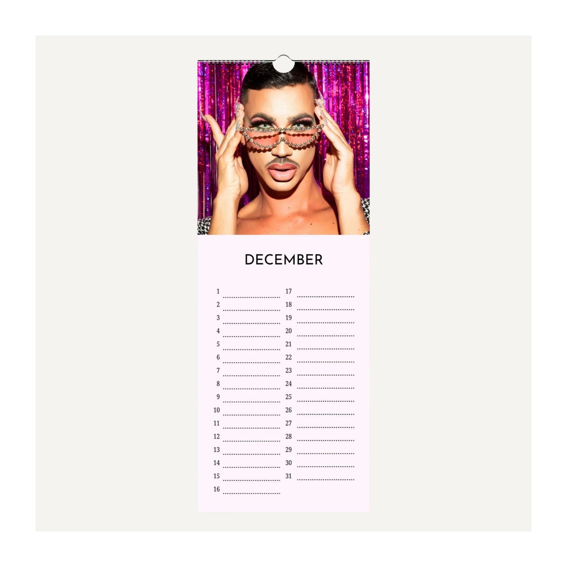 Drag Queens birthday calendar page for December with a person wearing sunglasses and a pink background.
