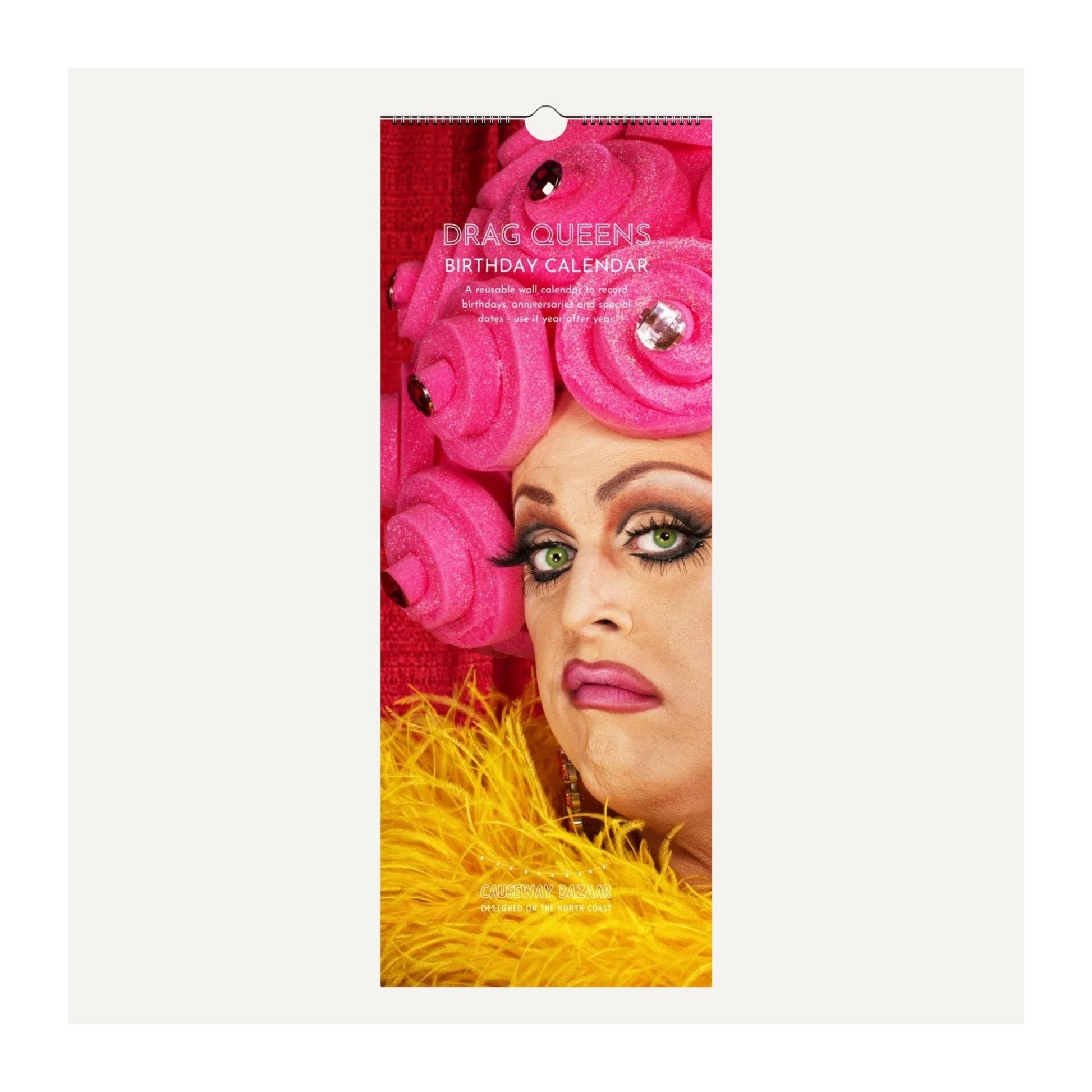 Full front image of drag queens birthday calendar depicting a drag queen's face and pink roses on a red background
