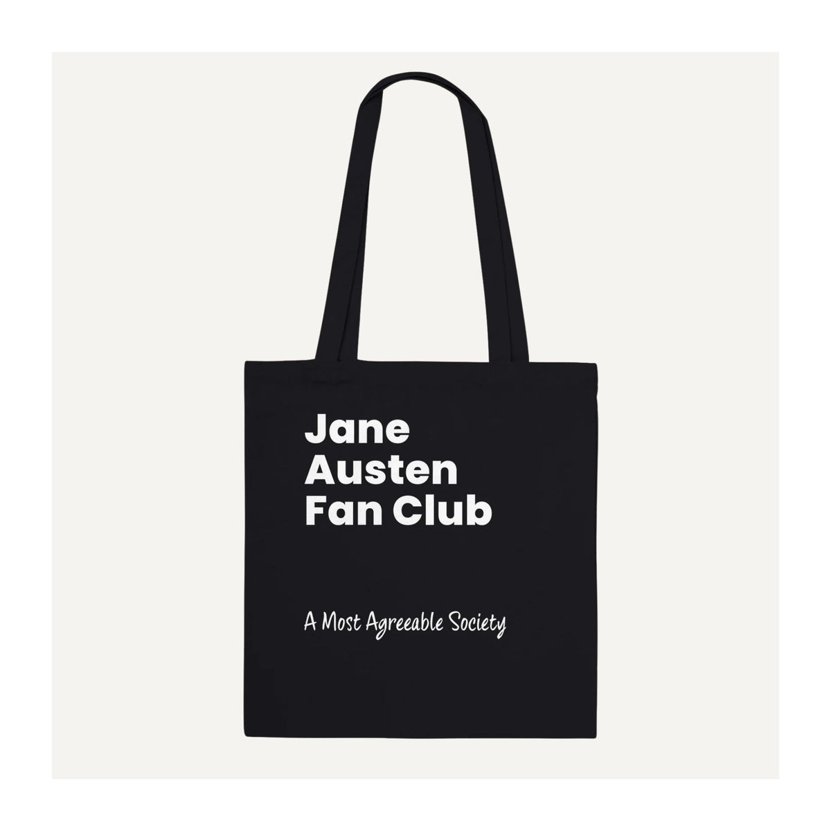 Black cotton Jane Austen Fan Club tote bag with bold white typography and handwritten-style “A Most Agreeable Society” lettering.