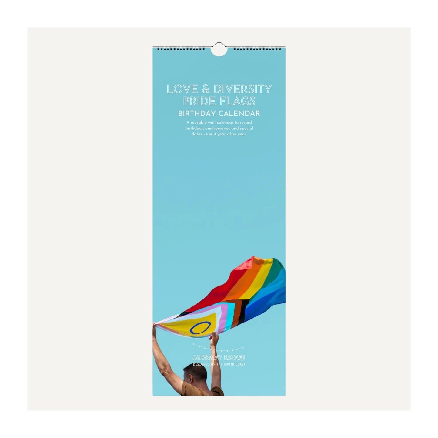 Love Diversity and Pride Flags Birthday Calendar front cover with a person holding a rainbow flag against a blue sky