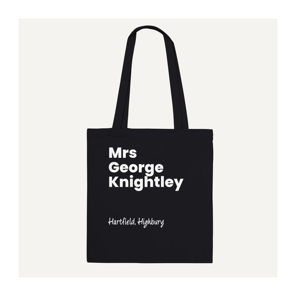 Black Jane Austen Emma tote bag featuring Mrs George Knightley in bold white lettering with Hartfield, Highbury beneath. Minimalist literary cotton bag with long shoulder handles.