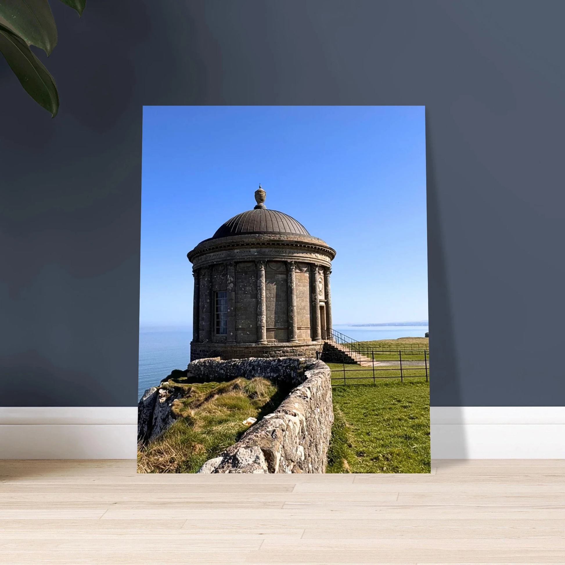 Mussenden Temple west view Downhill Northern Ireland against a grey blue wall