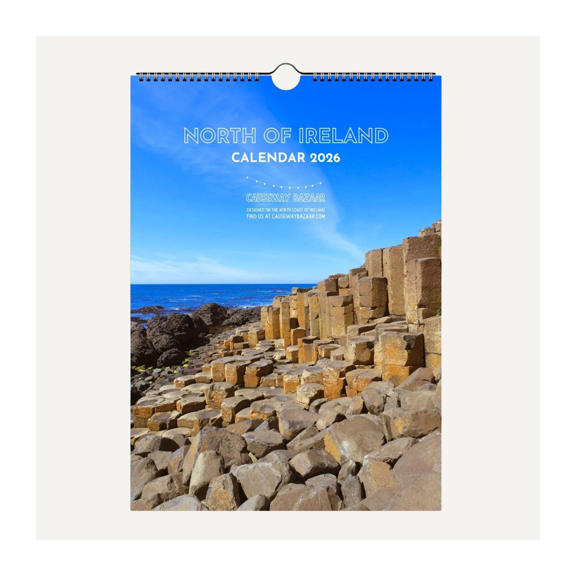 Calendar cover for 2026 featuring the North of Ireland with a scenic view of rocks and ocean.