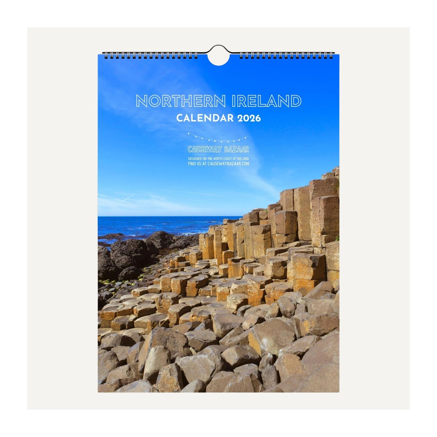 Full detail of front cover of the wall calendar featuring images of Northern Ireland with Giant's Causeway and a blue sky