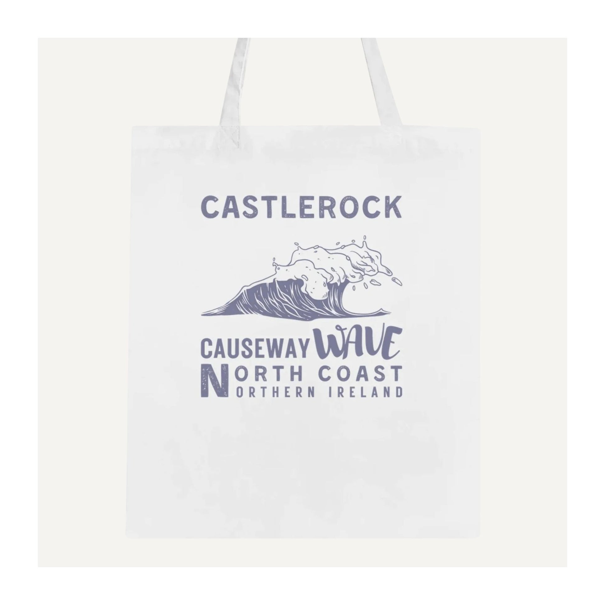 White tote bag with 'Castlerock Causeway Wave North Coast Northern Ireland' text and wave graphic.